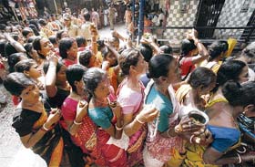 Women gather inside a temple as they celebrate Mahashivratri in Trakeshawar, about 50 km west of Kolkata