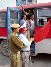 The police arresting state road transport corporation employees during a protest demonstration in Jammu on Friday.