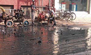 Sludge being removed from a sewer in Bhadaur house market in Ludhiana. 