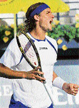 Spains Feliciano Lopez rejoices after beating Russias Nikolay Davydenko in the semifinal of the Dubai Tennis Championship