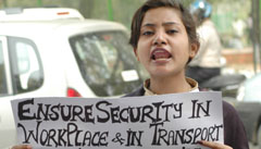 An activist of the Pragatisheel Mahila Sangathan demands proper security in work place for women working in BPOs and other sectors, on the occasion of International Womens Day in the Capital on Saturday.