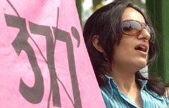 A gay rights activist protests against the law, which allegedly is biased against gays, lesbians and transgenders, in the Capital on Saturday.