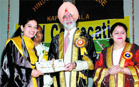 A students gets degree from DGP NPS Aulakh at Hindu Kanya College on Saturday.