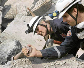 Rescuers helping a quake victim in Trapped 