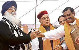 Punjab Chief Minister Prakash Singh Badal, Himachal Pradesh Chief Minister Prem Kumar Dhumal with former MP Satya Pal Jain (extreme right) during a samman samaroh organised by the Chandigarh unit of the BJP at Nehru Park in City Beautiful on Sunday. 
