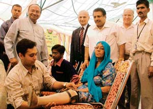 A physically-challenged woman gets a prosthetic limb at a camp organised by the Bharat Vikas Parishad in Ludhiana on Sunday. 