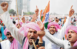 Congress workers at a farmers rally at Ramlila ground in New Delhi on Sunday. The rally was organised to thank the Manmohan Singh-led United Progressive Alliance government for waiving off Rs 60,000 farmers loans