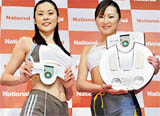 Models display Matsushita Electric Industrial's body composition monitor "EW-FA70" equipped with the newly developed optical subcutaneous-fat scanner