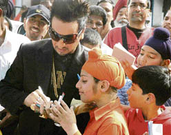 Punjabi pop singer Jazzy B signs autographs for his young fans in Patiala on Monday.