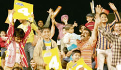 Spectators enjoy the second day ICL cricket match at Tau Devi Lal Stadium in Panchkula on Monday.