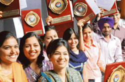 Students of the Correspondence Department of Panjab University in a jubiliant mood after getting prizes at their annual prize distribution function
