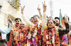 Newly elected mayor of the Jammu Municipal Corporation, Kavinder Gupta, along with party president Ashok Khajuria during a roadshow in Jammu 