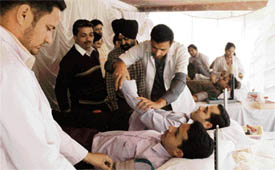 Volunteers donate blood at a camp in Ludhiana on Monday.