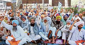 Farmers protest outside the deputy commissioners office in Ludhiana on Monday.
