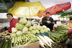 Chinese vendor sells vegetables at a market in Shenyang, northeast China's Liaoning province