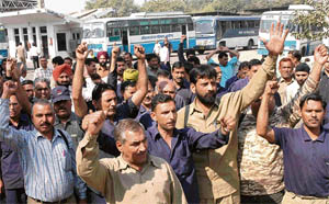 Haryana Roadways employees protest in support of their demands at Industrial Area in Chandigarh on Tuesday.