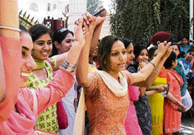 GCG girls make a human chain and block the college gate during a protest against the management in Patiala on Tuesday.