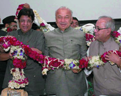Power minister Sushil Kumar Shinde, external affairs minister Pranab Muhkerjee and E . Ahmed at the launch of tasveer-e-hind website for NRIs in the Capital on Tuesday.