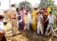 Wives of police personnel living in the New Police Lines on the National Highway No. 73 protest against power failure in the colony in Yamunanagar on Tuesday.