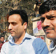 Arms dealer Suresh Nanda's son Sanjeev Nanda (left) taken to be produced in court in New Delhi on Tuesday.