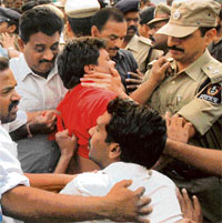 Police arrests a CPM activist during a protest rally outside the state assembly in Hyderabad on Tuesday.