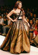 Bollywood actress Bipasha Basu displays designs by Gauri and Nainka on the first day of Wills lifestyle India Fashion Week in New Delhi on Wednesday.