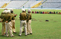 Policemen oversee security arrangements at the PCA stadium in Mohali on Wednesday.