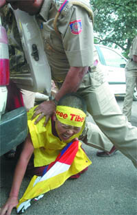 Policemen clash with Tibetan protestors at the Chinese Embassy to commemorate 49th Tibetan Women's Uprising Day in the Capital on Wednesday.