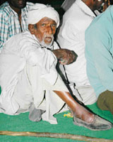 Ruparam (90) awaits his turn to get himself examined at a free medical check-up camp held on the birthday of MP and INLD leader Ajay Singh Chautala in Karnal on Wednesday.
