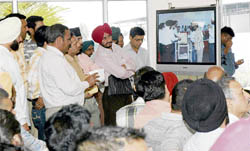 Applicants view the draw of lots of liquor vends in Ludhiana