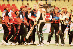 Kolkata Tigers Nantie Hayward celebrates victory over Mumbai Champs with his team mates after the fall of the Champs last wicket