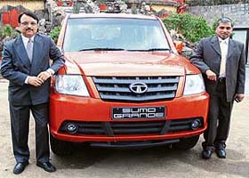 S.G. Saksena (L), head utility vehicles, Tata Motors, and Jalaj Gupta, regional manager, poses with Sumo Grande at its launch in New Delhi