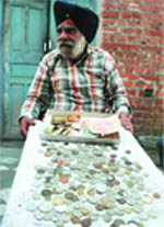 The man shows his rare collection of coins