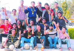 Players of NITs football team in a jubilant mood after receiving the trophy