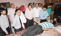 District police chief Dr Kaustubh Sharma accompanied by RIMT Group chairman Hukam Chand Bansal during a blood donation camp at RIMT complex on Thursday.