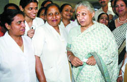 Delhi Chief Minster Sheila Dikshit shares lighter moments with nurses at a felicitation function by the Delhi Nurses Union at Lady Harding Medical College in the Capital