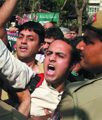 Activists of Roots in Kashmir protest against leader of Jammu Kashmir Liberation Front Yasin Malik, who attended India Today Conclave, outside the Taj Palace Hotel in the Capital on Saturday.