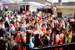 Students of Class X protesting outside the office of the state board of school education (Jammu) against paper leak.