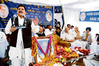 A leader of the Bahujan Samaj Party addresses party workers during the 74th birth anniversary celebrations of late Kanshi Ram in Jammu on Saturday.