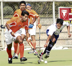 A match in progress between Indian Oil and Air Force during Guru Govind Singh Gold Cup Hockey Tournament being played at Astroturf Stadium, Punjab Agriculture University, on Saturday.