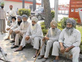 Farmers Harvinder Singh, Mohan Singh, Hari Singh, Satvinder Singh, Dhanna Singh, Jagir Singh and Baljinder Singh of Jodhan village, Ludhiana, discuss the loan waiver.