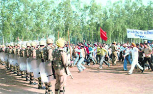 Police officials stop a mob during a demonstration at the Recruitment Training Centre, Sector 26, in Chandigarh on Sunday.