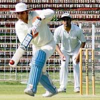 Vikas Kala of Fulletron India in action against HDFC bank during Bharat Keshav Gupta memorial cricket match at Sector 16, Chandigarh, on Sunday.