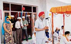 Councillor of the Warwickshire County Council Mota Singh dedicates Gilly Mundy Memorial Community School to the local people in Lehrian village in Fatehabad on Monday. 