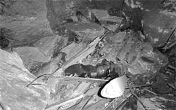 A damaged motorcycle (top) and belongings of victims of landslide on the Manali-Rohtang road on Monday.