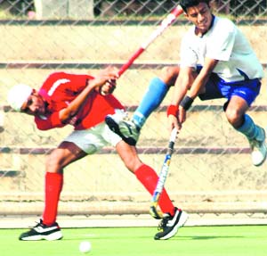 Players from the Punjab Police and Indian Air Force teams slug it out during the keenly contested match in Ludhiana.