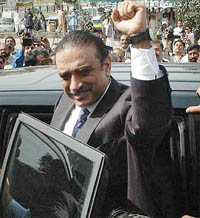 Asif Ali Zardari, co-chairperson of the Pakistan People's Party, gestures as he arrives to attend the National Assembly session in Islamabad on Monday.