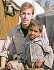 A file photo of Michael Blakey sitting with a polio-affected child in Dharamsala.