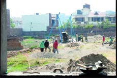 The underconstruction multi-storey shopping complex in Defence Colony on Cantonment Road