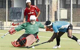 Players from Punjab Police and Indian Oil Corporation teams fight it out during the match held at the Punjab Agricultural University, Ludhiana, on Tuesday.